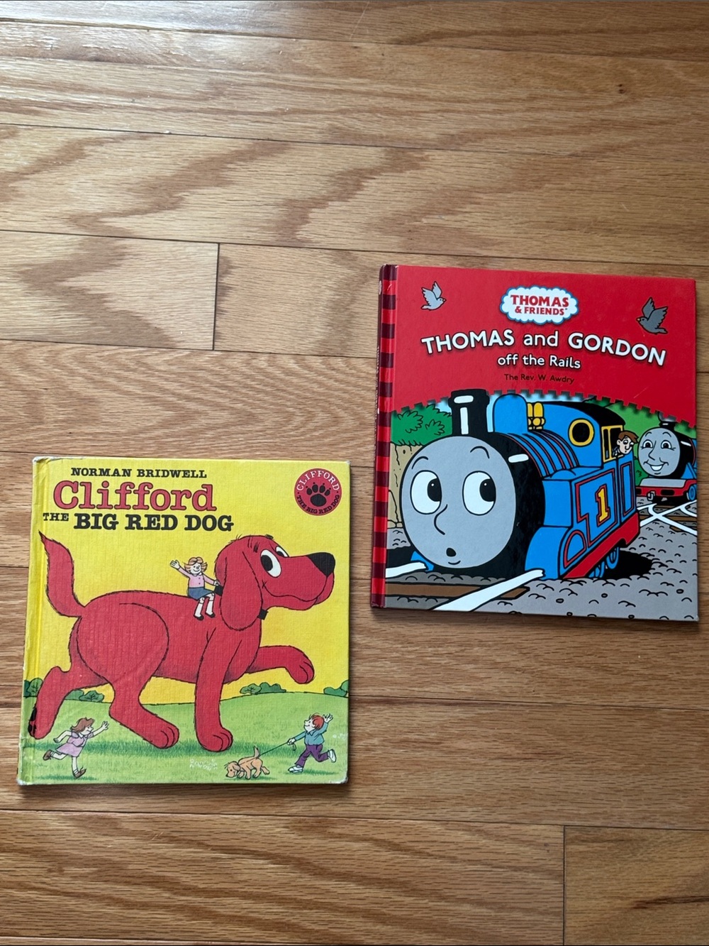 Two hard cover children’s books: Thomas and Gordon off the rails and Clifford